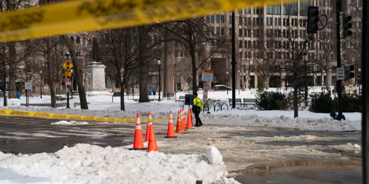 DC crews pile snow at RFK Stadium site as city slowly digs out of storm